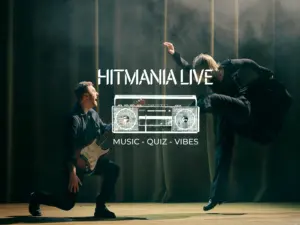 Hitmania Live Musiker och dansare uppträder under den interaktiva konferensaktiviteten Hitmania Live.